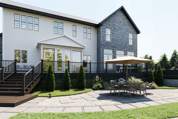 3D rendering of a bluestone patio and deck dining area behind a home