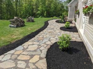 Natural flagstone path with mulch beds and plantings by Globe Green, Concord, NH area