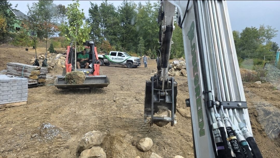 Globe Green crew, excavator and truck on a large landscaping job near Concord, NH