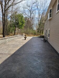 Paver patio along the side of a house by Globe Green, Concord, NH area