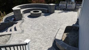 Paver patio with fire pit and wall-cap steps by Globe Green, Concord, NH area