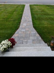 Long paver walkway with a step to the front door, Concord, NH area