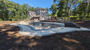 Pool deck patio under construction by Globe Green in the Concord, NH area