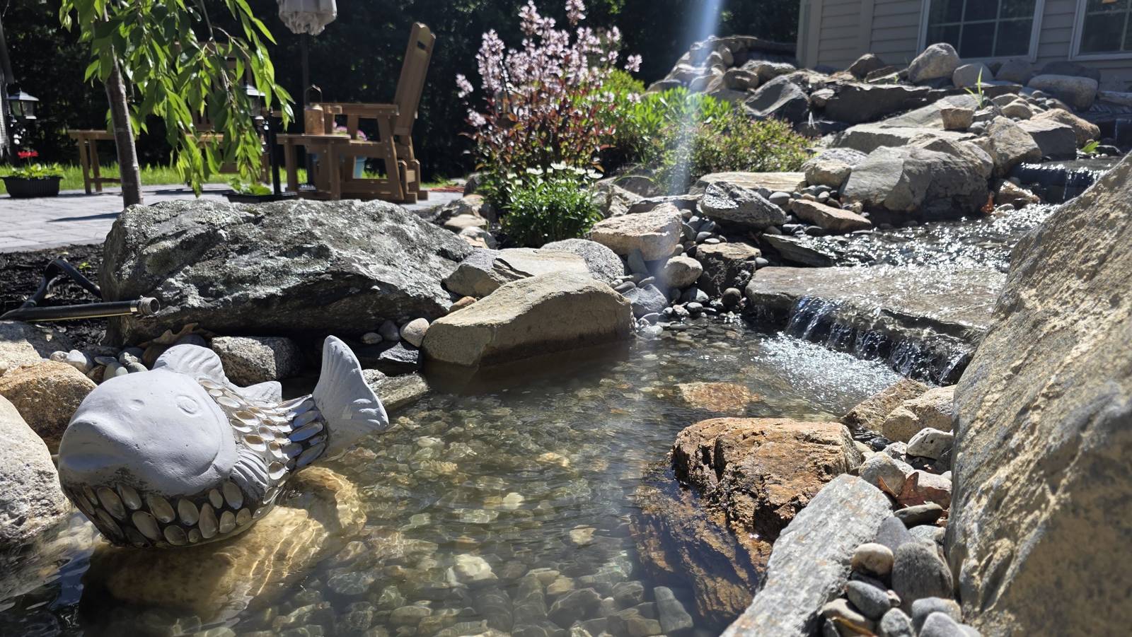 Pondless waterfall and stream with natural boulders built by Globe Green near Concord, NH
