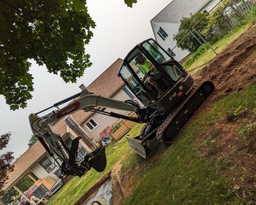 landscaping company with backhoe and skid steer near me
